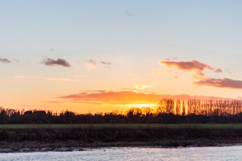 Sunset over the River Great Ouse, view from the Nobles Field in St Ives, Cambridgeshire