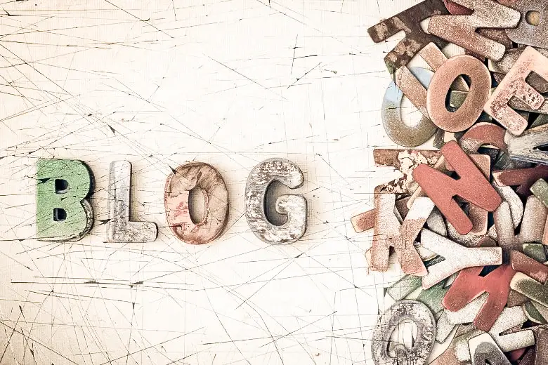 Word BLOG made from wooden letters with a pile of letters next to it - featured image for blogging workflow