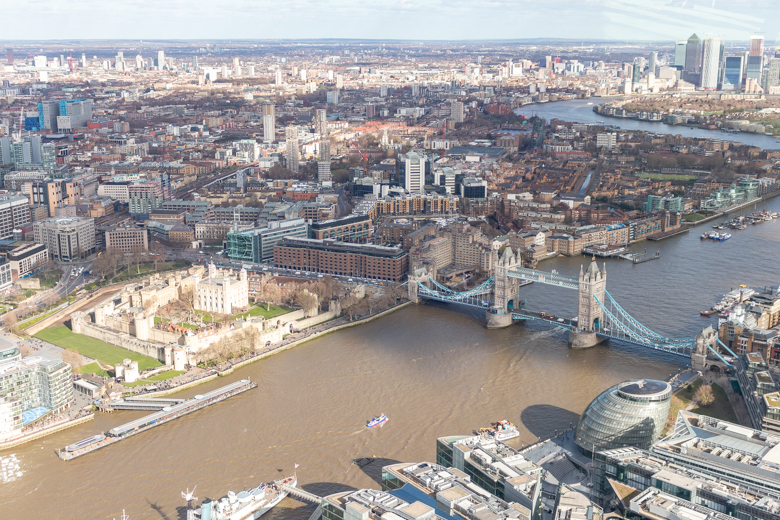 View of the Tower Bridge, River Thames, and London from The Shard - pros and cons of living in England